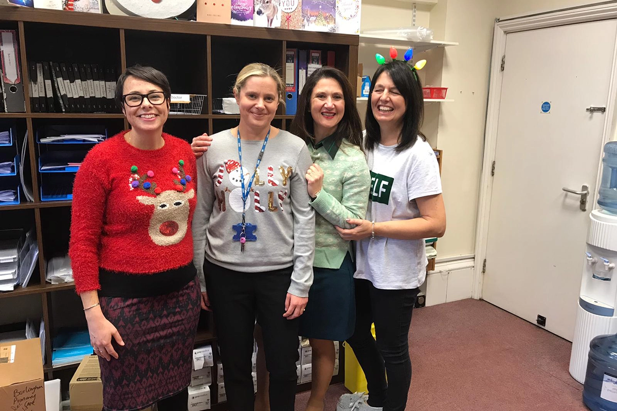Image of staff in Christmas jumpers